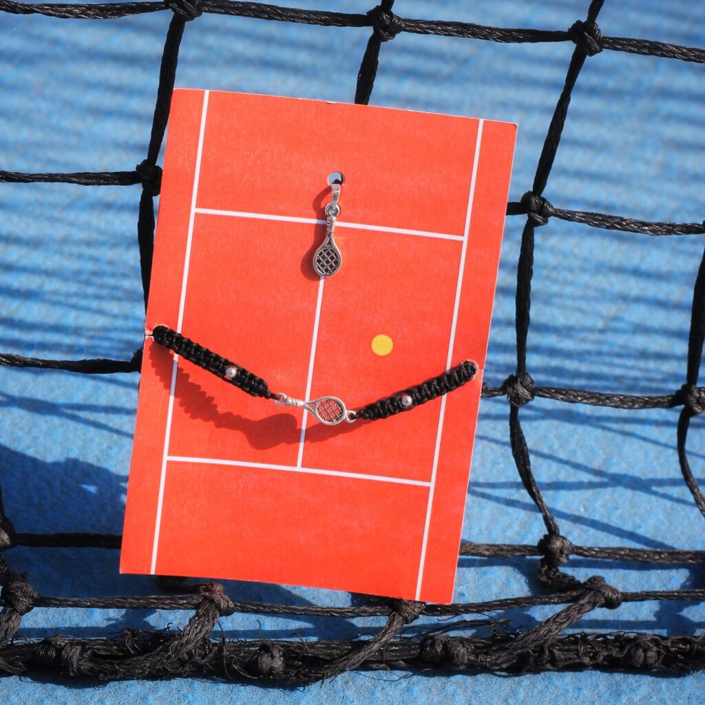 Curated handcrafted tennis jewelry set with hand-braided black cord bracelets and inspired tennis details. Unisex sporty luxury gift set for tennis lovers.